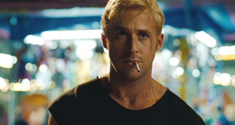 The Place Beyond The Pines 2012 Movie Scene Ryan Gosling as Luke, a bank robber with tattoos on his face, blonde hair and smoking a cigarette
