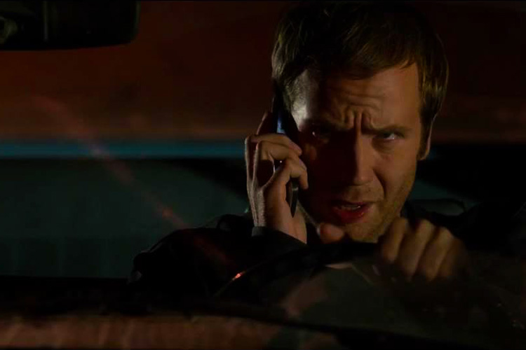 13 Sins [2014] Movie Mark Webber as Elliot Brindle talking on a mobile phone in a car scene