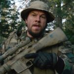 Lone Survivor 2013 Movie Scene Mark Wahlberg as Marcus Luttrell holding a gun about to go into the fight