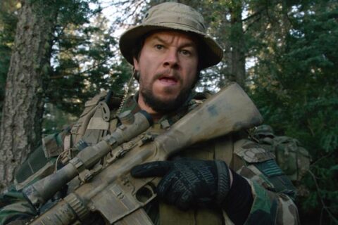 Lone Survivor 2013 Movie Scene Mark Wahlberg as Marcus Luttrell holding a gun about to go into the fight