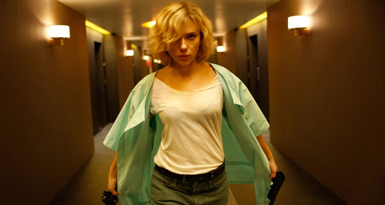 Lucy [2014] Movie Scarlett Johansson holding two guns and walking down the hallway scene