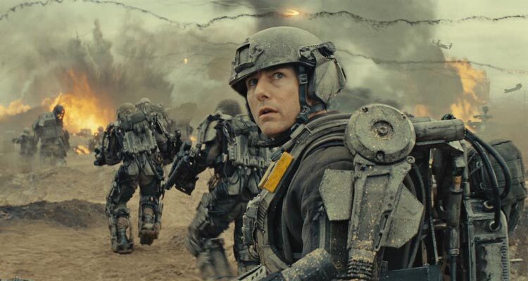 Edge of Tomorrow 2014 Movie Scene Tom Cruise as Cage wearing an exoskeleton on the beach attacking aliens