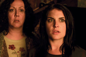 Housebound 2014 movie Morgana O'Reilly as Kylie Bucknell and Rima Te Wiata as Miriam Bucknell looking in horror scene