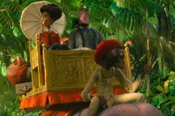 Missing Link 2019 Hugh Jackman as Sir Lionel Frost and Zoe Saldana as Adelina Fortnight riding an elephant on their way to Shangri-La