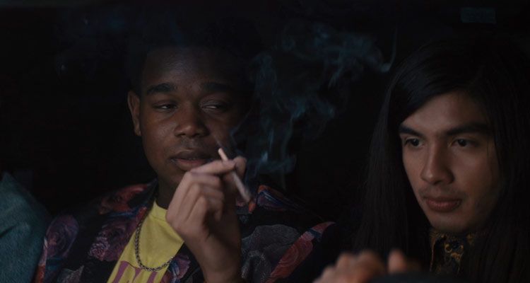 The Binge 2020 Movie Dexter Darden as Hags and Eduardo Franco as Andrew smoking weed while driving