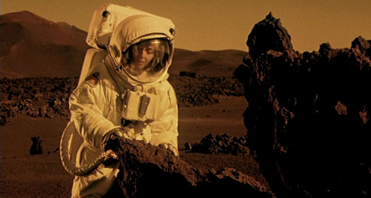 Stranded 2001 Movie Maria de Medeiros in spacesuit walking on the surface of Mars