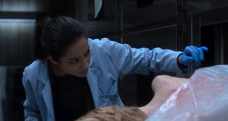 The Possession of Hannah Grace 2018 Movie Shay Mitchell looking at the corpse of Hanna in the morgue