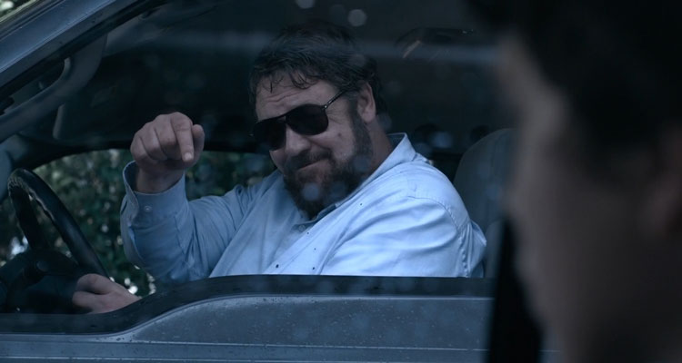 Unhinged 2020 Movie Russell Crowe pointing his finger instructing Caren Pistorius to roll her windows down