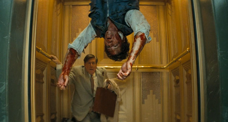 Down 2001 Movie Edward Herrmann in an elevator looking at a bloody dead body hanging upside down
