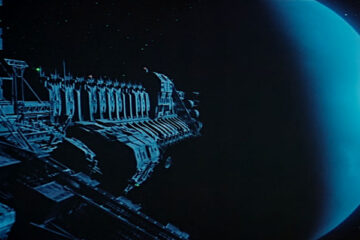 Moon 44 1990 Movie Giant transport vessel or spaceship getting close to the blue moon