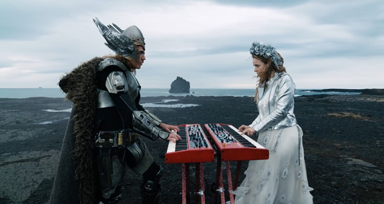 Eurovision Song Contest The Story of Fire Saga 2020 Movie Will Ferrell dressed as a viking superhero and Rachel McAdams in a fancy dress playing keyboards