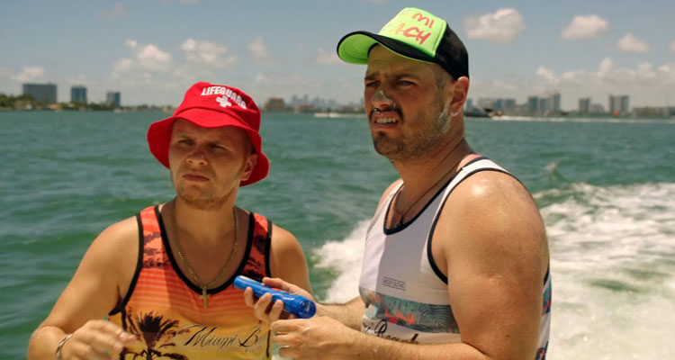 Miami Bici 2020 Movie Matei Dima and Codin Maticiuc on a boat putting on sunscreen