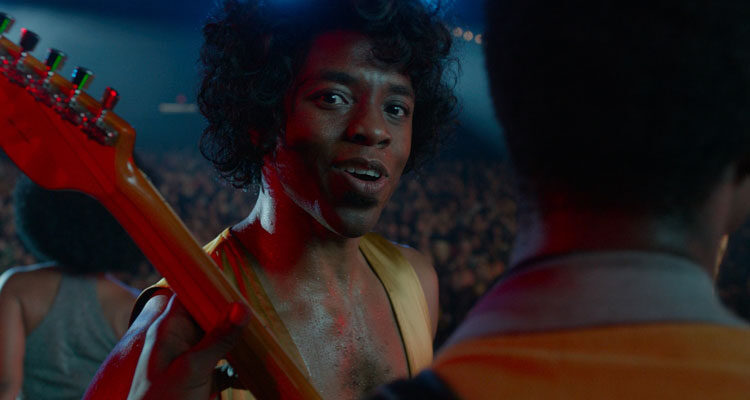Get on Up 2014 Movie Chadwick Boseman as James Brown in a golden onesie talking to the camera