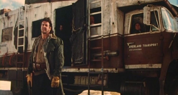 Neon City 1991 Movie Lyle Alzado as bulk standing in front of the bus holding a gun