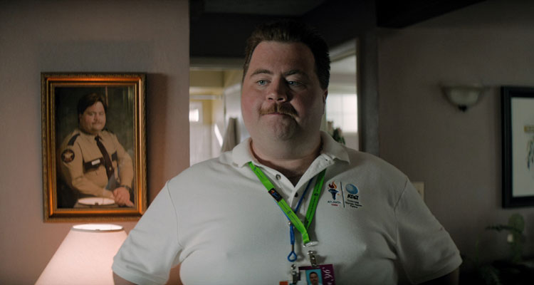 Richard Jewell 2019 Movie Paul Walter Hauser dressed in a security guard shirt with his pass