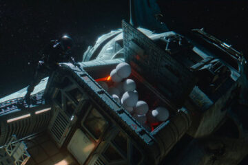 Space Sweepers 2021 Movie One of the crew opening a ship's cargo hold and releasing a bunch of white balls