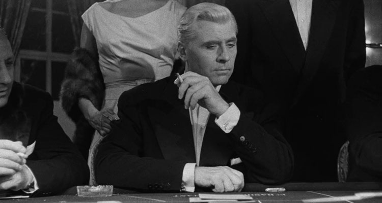 Bob Le Flambeur 1956 Movie Roger Duchesne as Robert 'Bob' Montagné gambling in a casino and smoking a cigarette