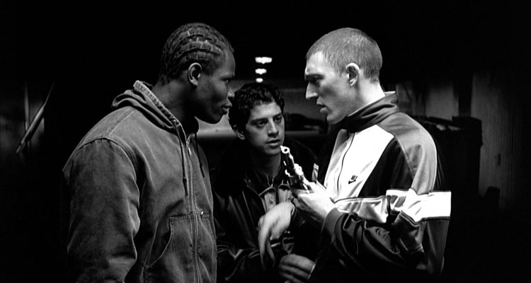 La Haine 1995 Movie Vincent Cassel as Vinz holding a gun next to Hubert Koundé and Saïd Taghmaoui
