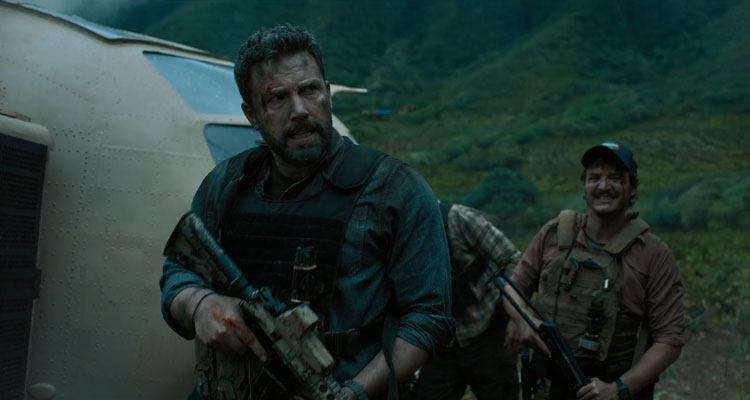 Triple Frontier 2019 Movie Ben Affleck as Tom Redfly Davis and Pedro Pascal as Francisco Catfish Morales standing with guns
