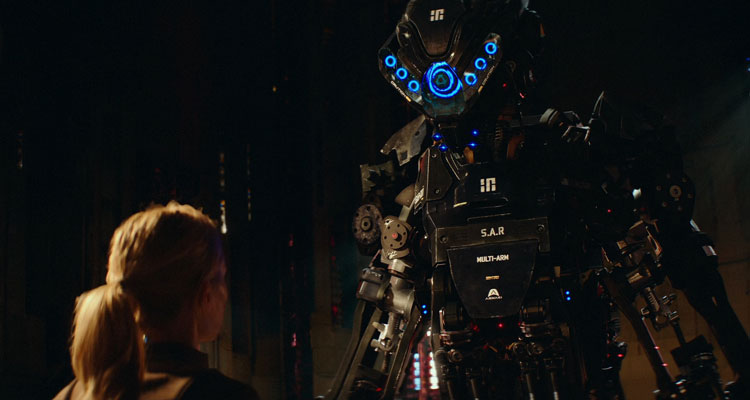 Kill Command 2016 Movie Scene Vanessa Kirby as Mills looking at a giant SAR killer robot