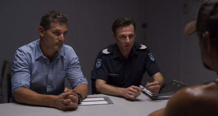 The Dry 2020 Movie Scene Eric Bana as Aaron Falk and Keir O'Donnell as Greg Raco in the interrogation room