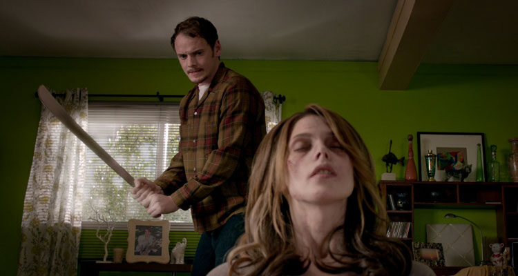Burying the Ex 2014 Movie Scene Anton Yelchin as Max holding a machete as he about to swing at Ashley Greene as Evelyn