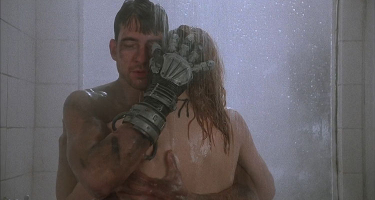 Hardware 1990 Movie Scene Dylan McDermott as Mo caressing Stacey Travis as Jill with his cybernetic hand