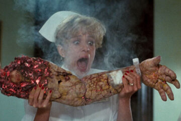 Innocent Blood 1992 Movie Scene Nurse holding a severed arm that's burning up and screaming