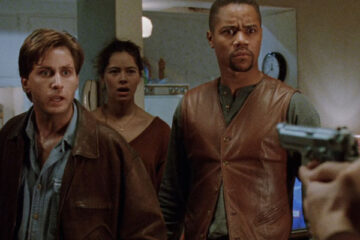 Judgment Night 1993 Movie Scene Emilio Estevez as Frank and Cuba Gooding Jr. as Mike with Angela Alvarado as Rita behind in her apartment
