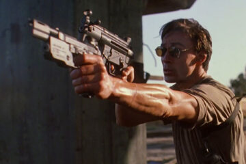 Nemesis 1992 Movie Scene Olivier Gruner holding two guns