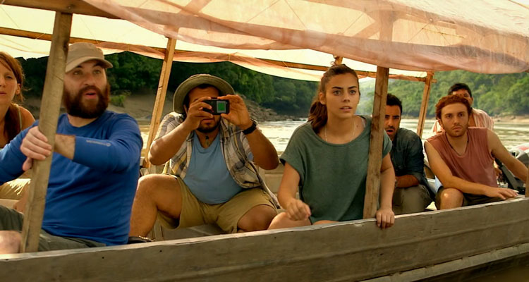 The Green Inferno 2013 Movie Scene Lorenza Izzo as Justine, Daryl Sabara as Lars and Nicolás Martínez as Daniel riding a boat down the river with others and admiring the nature