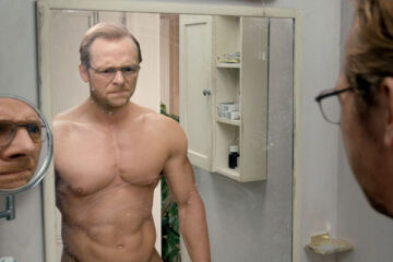 Absolutely Anything 2015 Movie Scene Simon Pegg as Neil looking in the mirror at his muscular body after he made a wish to look good