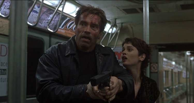 End Of Days 1999 Movie Scene Arnold Schwarzenegger as Jericho and Robin Tunney as Christine holding a gun in subway