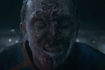 Goal of the Dead 2014 Movie Scene Football player turned into a zombie foaming at the football field