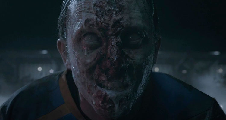 Goal of the Dead 2014 Movie Scene Football player turned into a zombie foaming at the football field