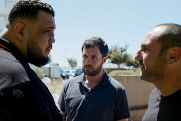 The Stronghold AKA BAC Nord 2020 Movie Scene Gilles Lellouche as Greg Cerva and Karim Leklou as Yass arguing with a huge gang boss