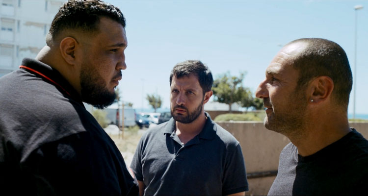 The Stronghold AKA BAC Nord 2020 Movie Scene Gilles Lellouche as Greg Cerva and Karim Leklou as Yass arguing with a huge gang boss