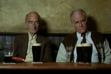Waking Ned Devine 1998 Movie Scene Ian Bannen as Jackie O'Shea and David Kelly as Michael O'Sullivan drinking beer in a pub