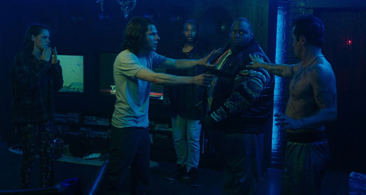 American Ultra 2015 Movie Scene Jesse Eisenberg as Mike Howell holding a gun in John Leguizamo as Rose's house with Kristen Stewart as Phoebe Larson, Lavell Crawford as Big Harold and Sam Malone as Quinzin