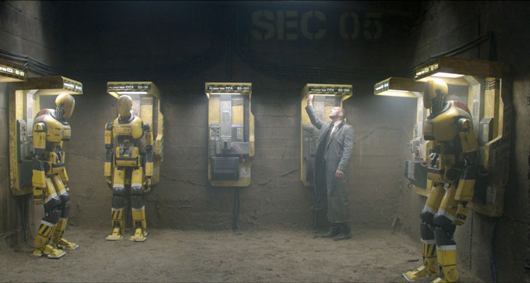 Automata 2014 Movie Scene Antonio Banderas as Jacq Vaucan in the robot charging station with couple of them charging