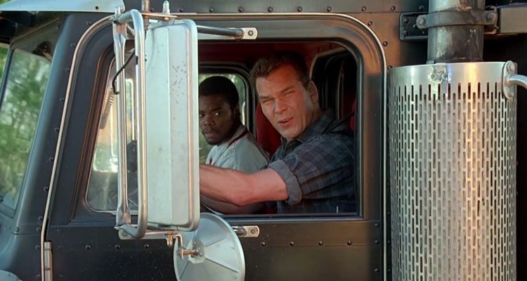 Black Dog 1998 Movie Scene Patrick Swayze as Jack Crews and Gabriel Casseus as Sonny looking at an exposion