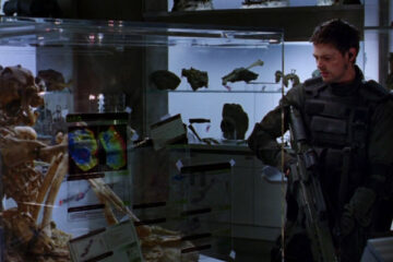 Doom 2005 Movie Scene Karl Urban as John Grimm looking at the skeletal remains in the lab