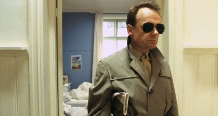 Elling 2001 Movie Scene Per Christian Ellefsen as Elling wearing a trench coat and sunglasses