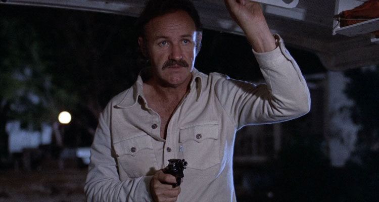 Night Moves 1975 Movie Scene Gene Hackman as Harry Moseby holding a gun on a boat
