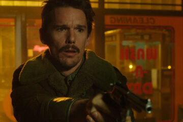 Predestination 2014 Movie Scene Ethan Hawke as The Barkeep holding a gun in a laundry room