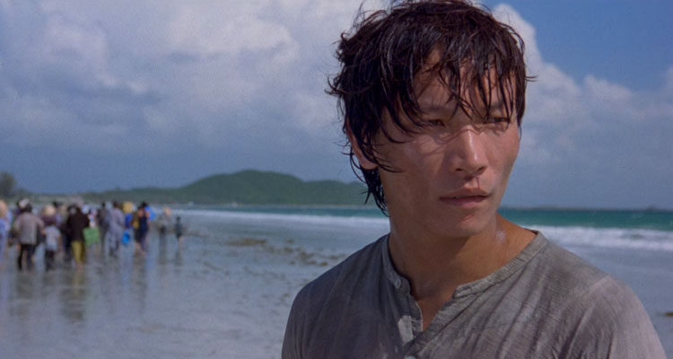 The Beautiful Country 2004 Movie Scene Damien Nguyen as Binh at the beach with the rest of the refugees running in the background