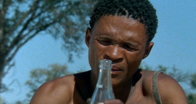 The Gods Must Be Crazy 1980 Movie Scene N!xau as Xi, Bushman looking at the bottle of Coca-Cola that fell out of the sky