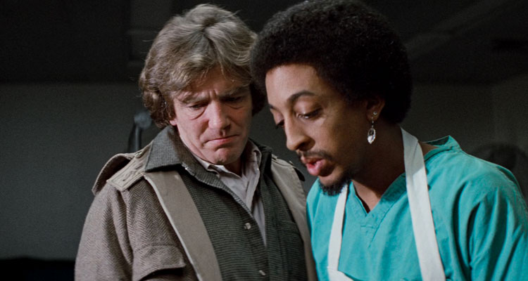 Wolfen 1981 Movie Scene Albert Finney as Dewey and Gregory Hines as Whittington during an autopsy of one of the victims