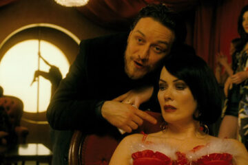 Filth 2013 Movie Scene James McAvoy as Bruce pointing at the prostitute in the brothel