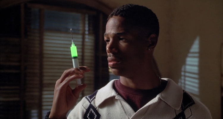 Senseless 1998 Movie Scene Marlon Wayans as Darryl Witherspoon holding an injection with glowing green liquid